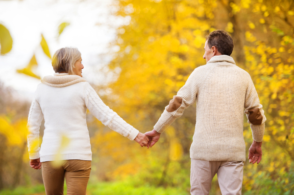 Senior couple in autumn nature.