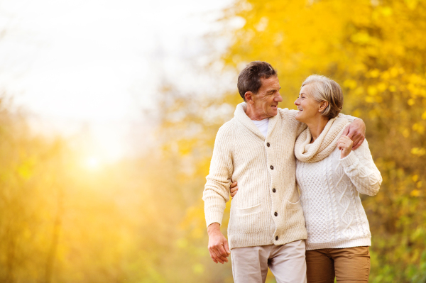 Senior couple in autumn nature.