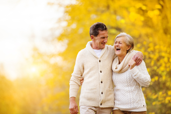 Senior couple in autumn nature.