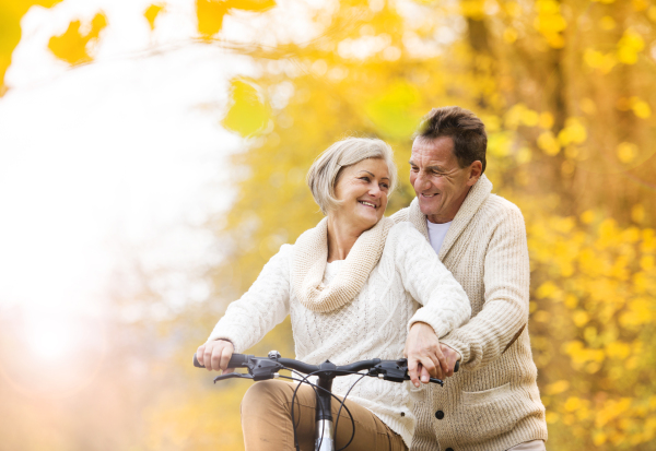 Senior couple in autumn nature.