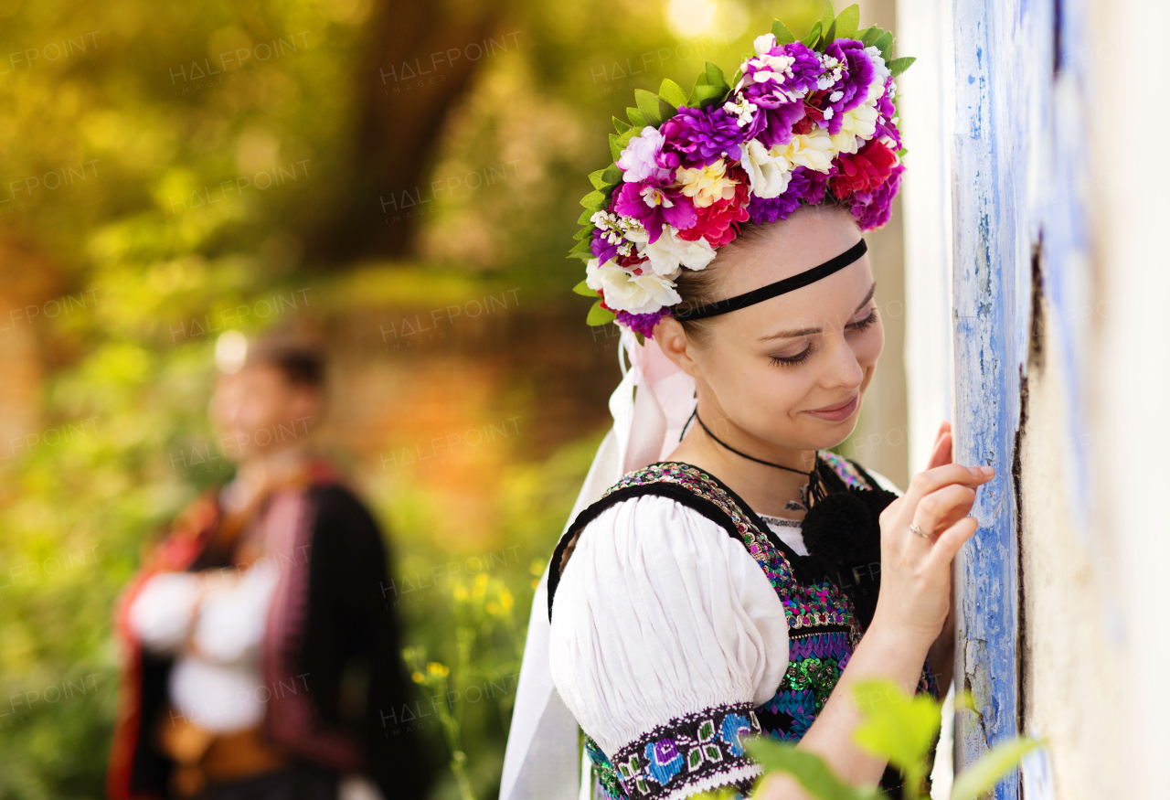 Beautiful traditional folk couple outdoors.