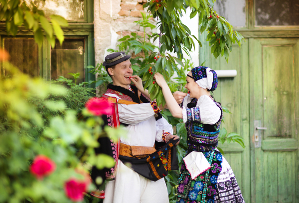 Beautiful traditional folk couple outdoors.