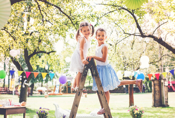 Family celebration outside in the backyard. Big garden party. Birthday party.