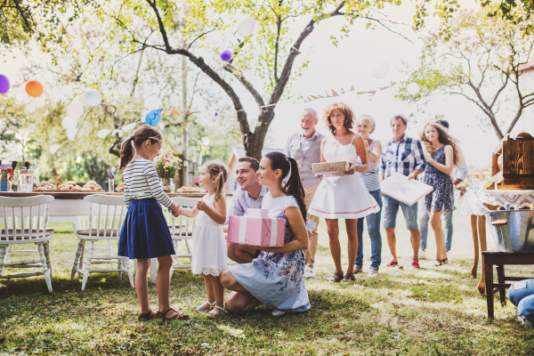 Family celebration outside in the backyard. Big garden party. Birthday party.