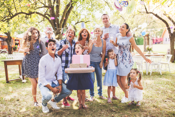 Family celebration outside in the backyard. Big garden party. Birthday party.