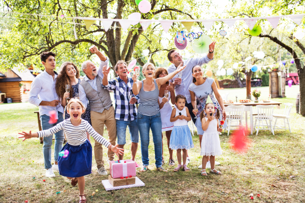 Family celebration outside in the backyard. Big garden party. Birthday party.