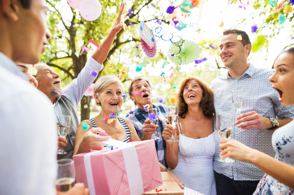 Family celebration outside in the backyard. Big garden party. Birthday party.