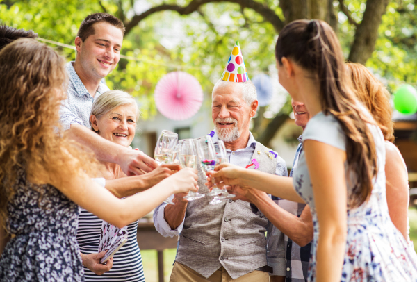 Family celebration outside in the backyard. Big garden party. Birthday party.