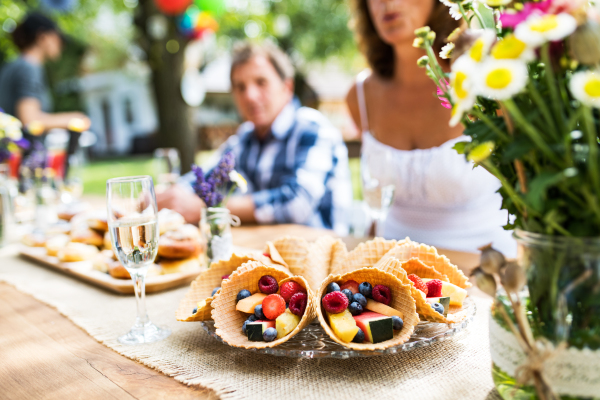 Family celebration outside in the backyard. Big garden party.