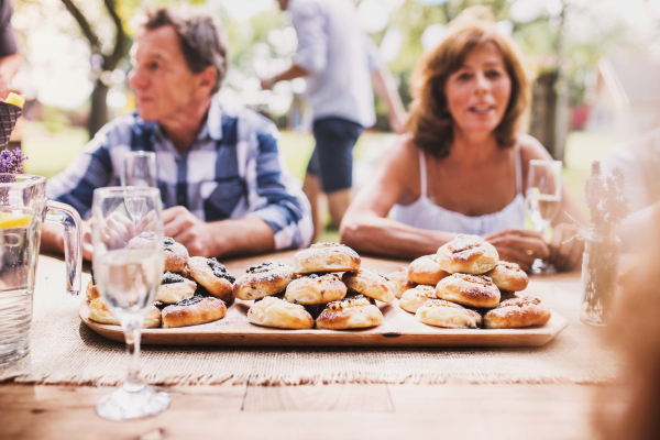 Family celebration outside in the backyard. Big garden party.