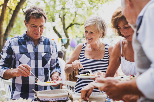 Family celebration outside in the backyard. Big garden party.