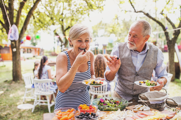 Family celebration outside in the backyard. Big garden party.