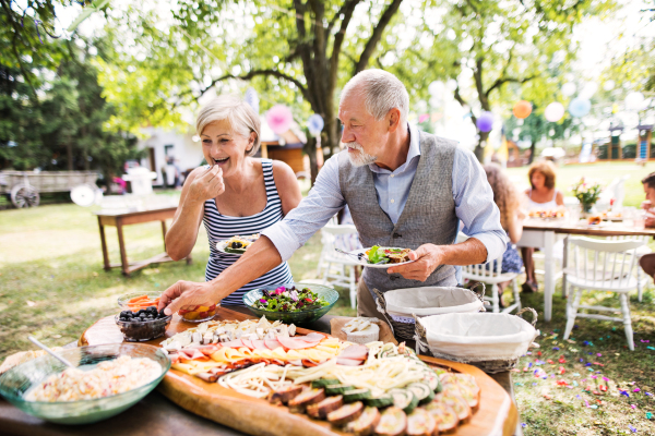 Family celebration outside in the backyard. Big garden party.