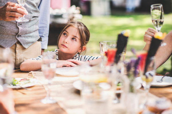 Family celebration outside in the backyard. Big garden party.