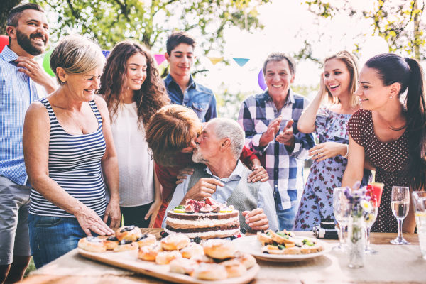 Family celebration outside in the backyard. Big garden party. Birthday party.