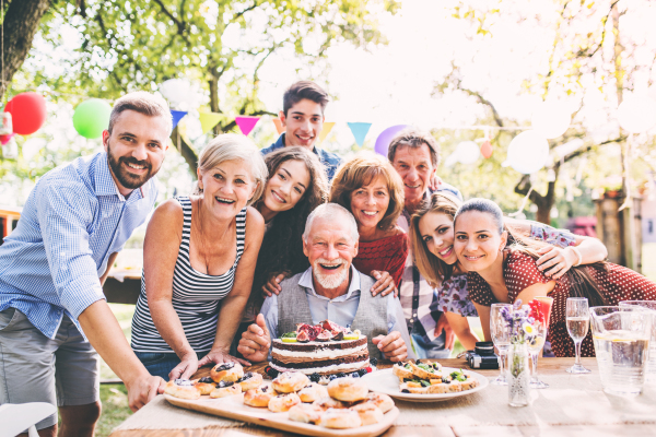 Family celebration outside in the backyard. Big garden party. Birthday party.