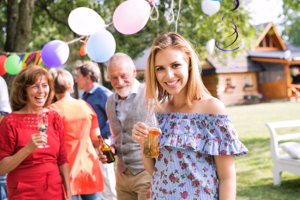 Family celebration outside in the backyard. Big garden party.