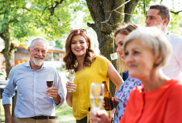 Family celebration outside in the backyard. Big garden party.