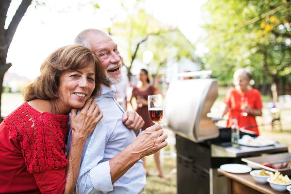 Family celebration outside in the backyard. Barbecue party.