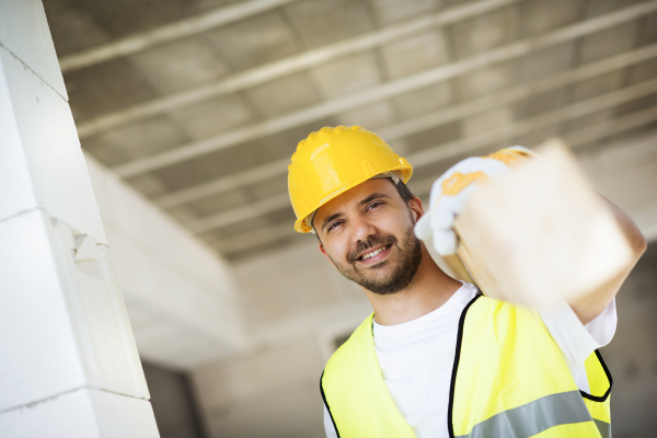 Two builders working on building.