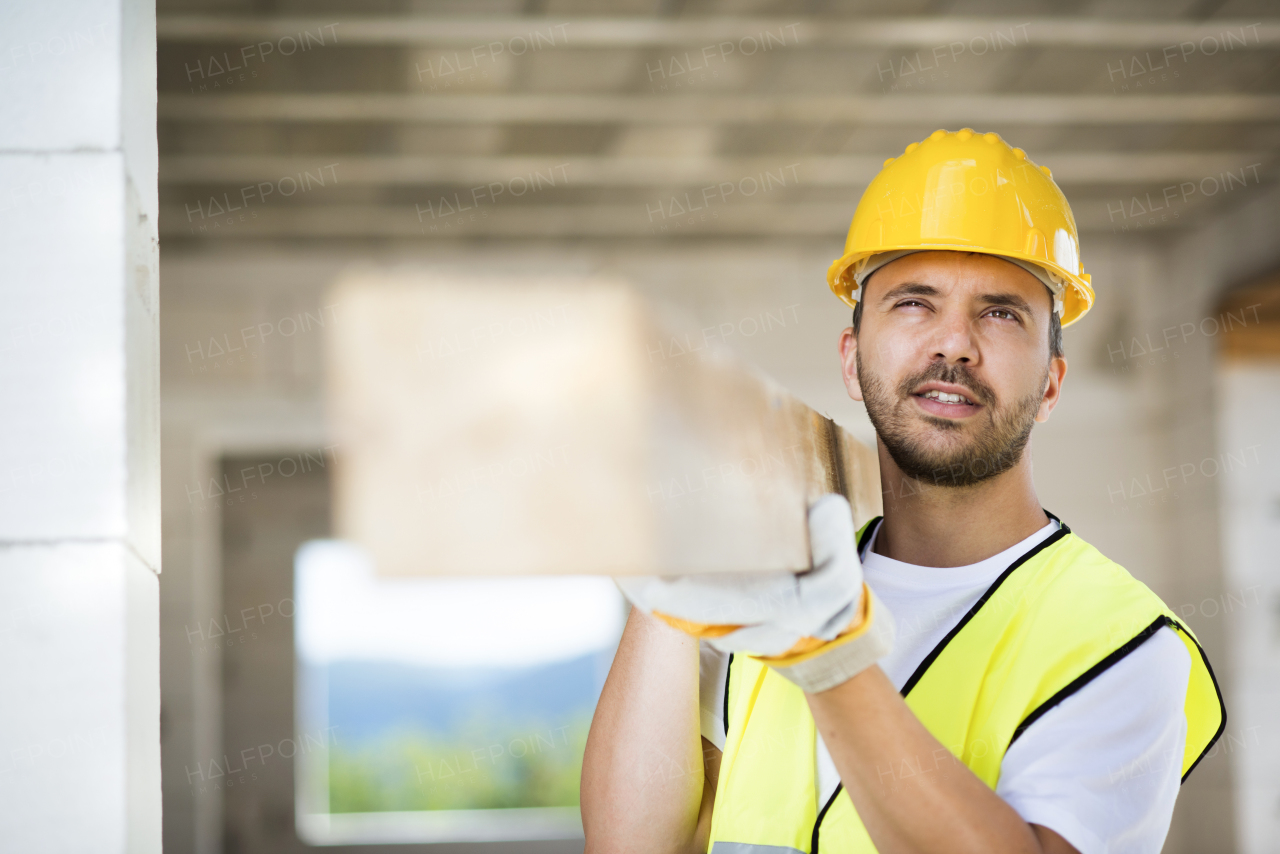 Two builders working on building.