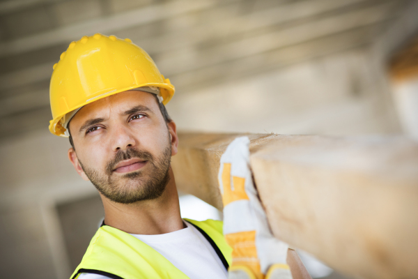 Two builders working on building.