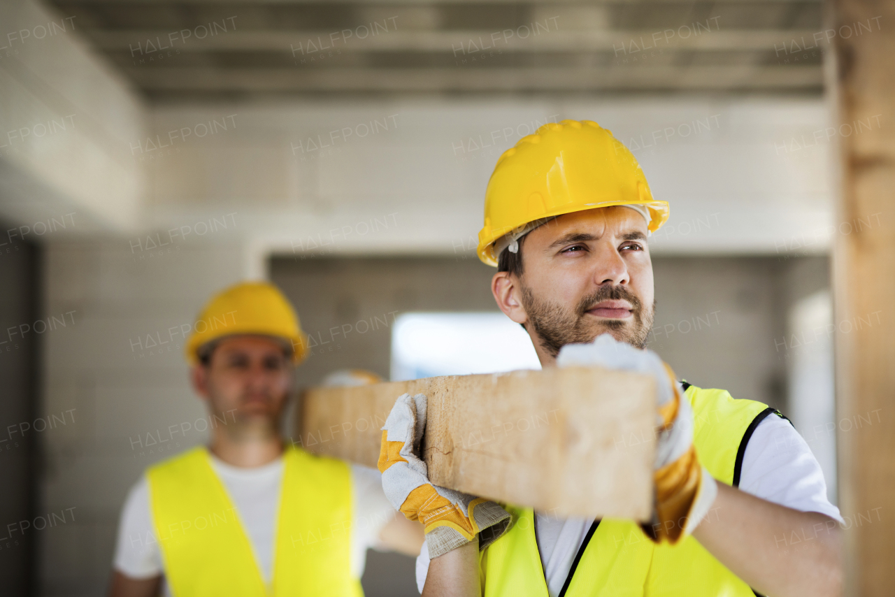 Two builders working on building.