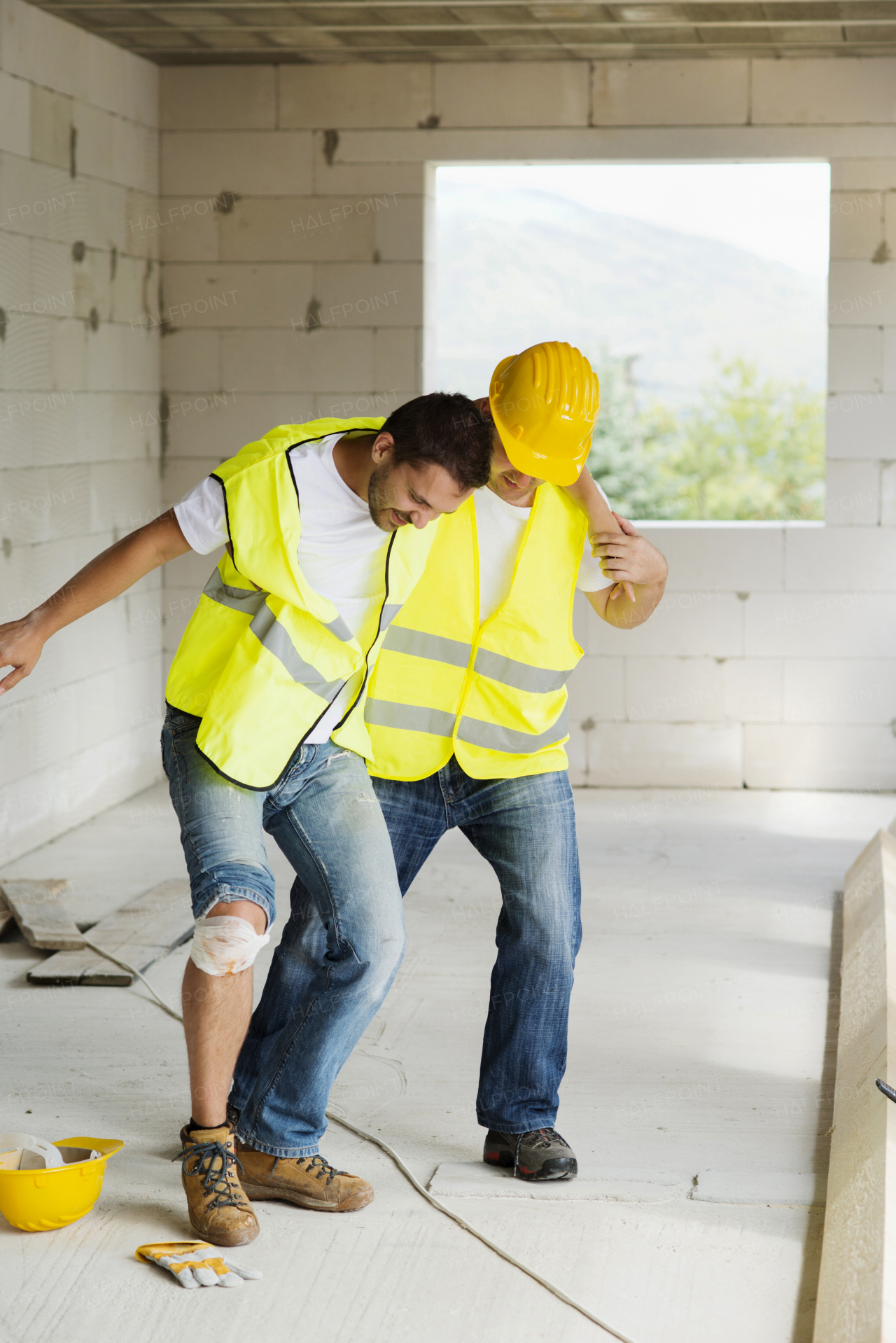 Two builders working on building.