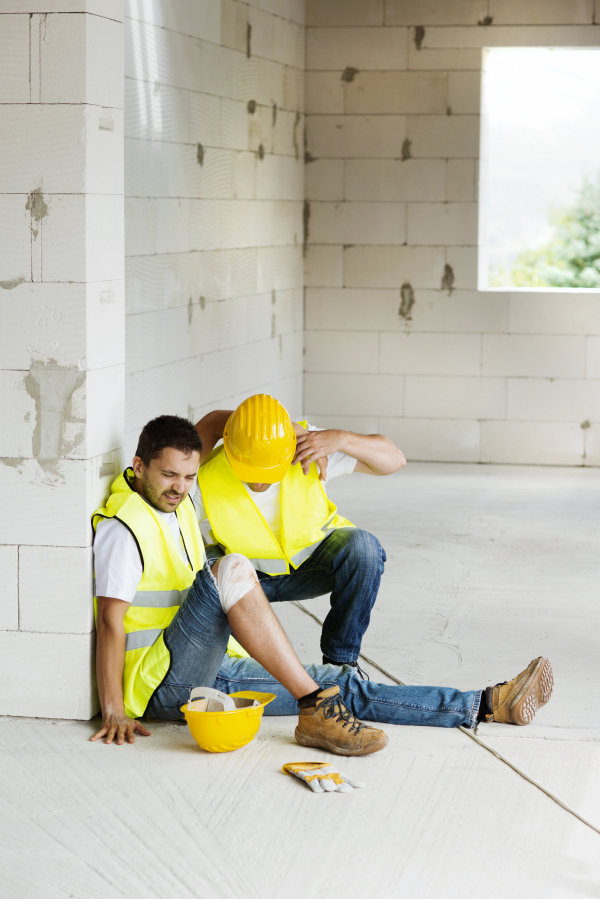 Two builders working on building.