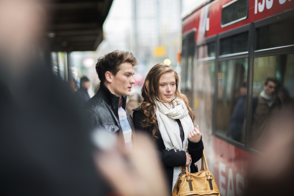 Beautiful young couple in city.