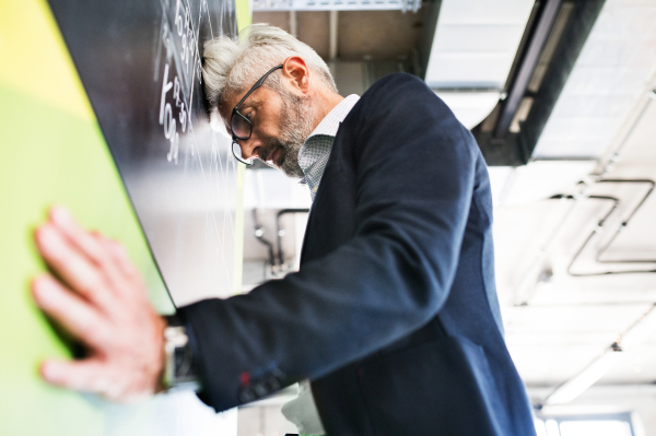 Disappointed or worried mature businessman in the office.