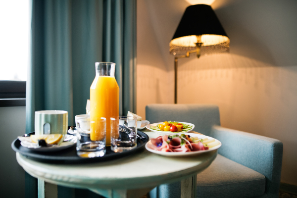 Food on a table in a hotel room. Breakfast in a hotel room.