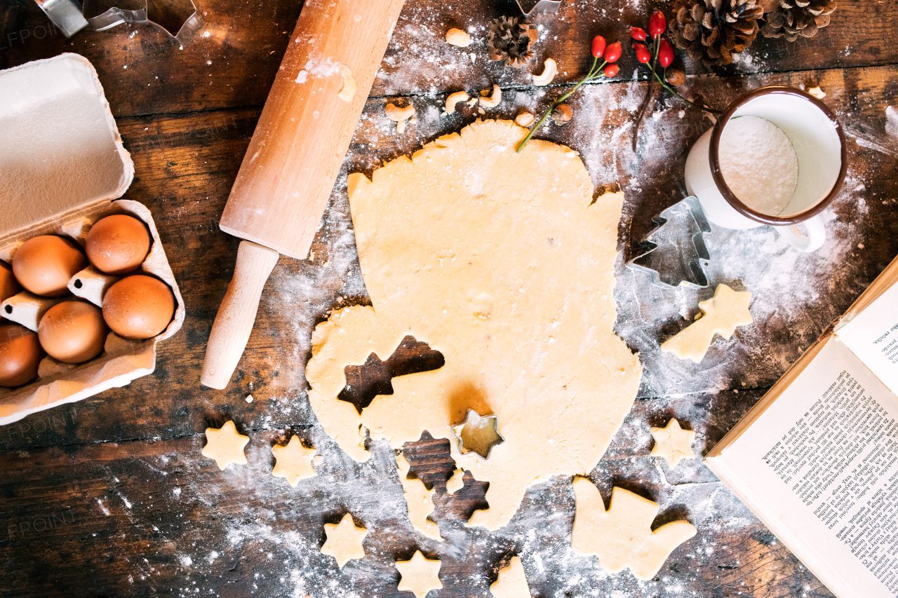 Baking gingerbread cookies at Christmas time. Ingredients on the wooden table. High angle view.