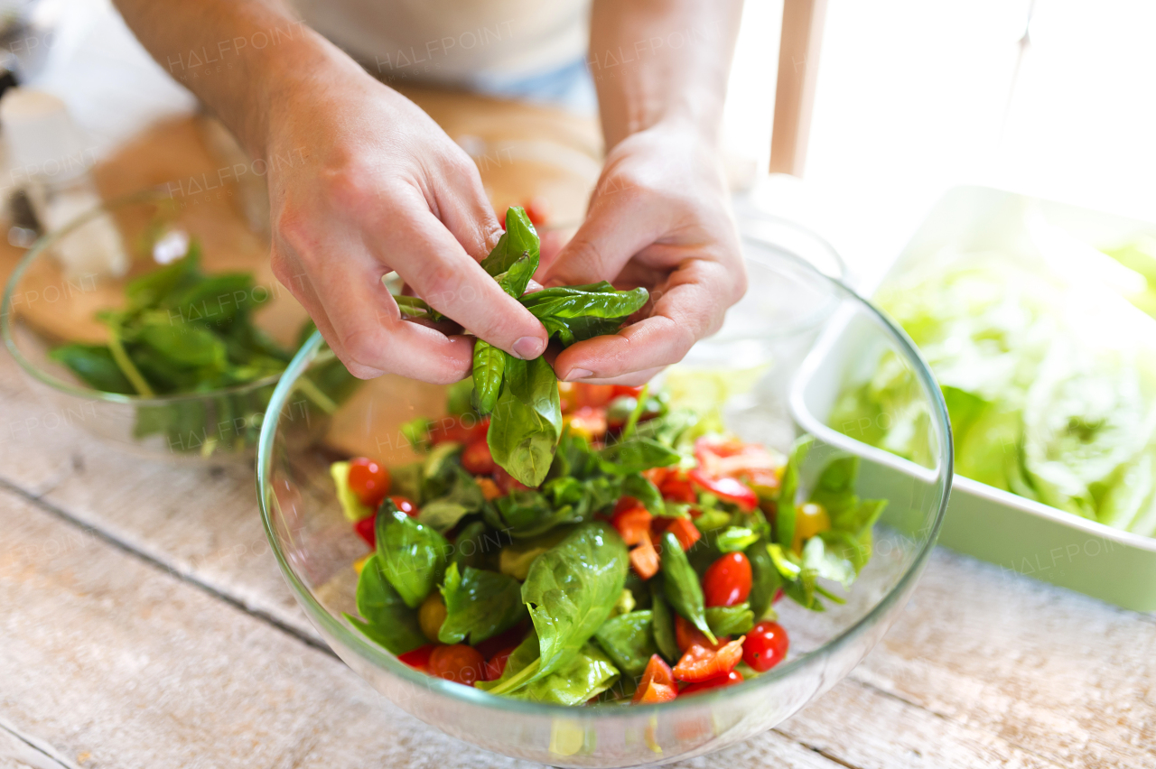 Young man cooking healthy food.