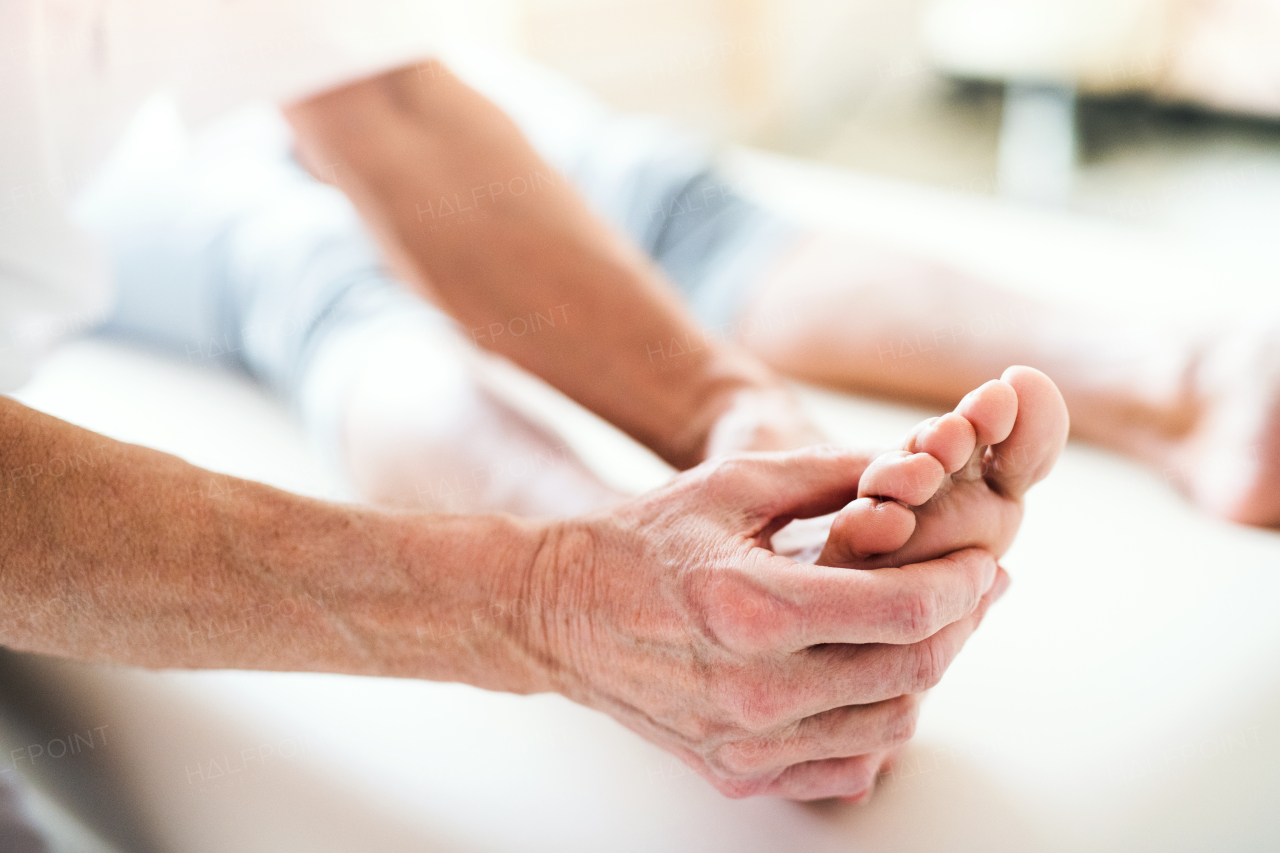 An unrecognizable physiotherapist working with a patient. Close up.