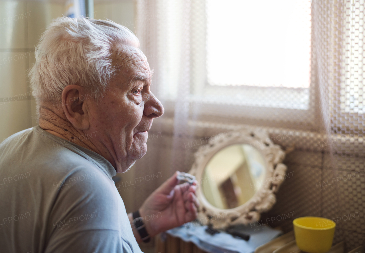 Very old man spending time at home.