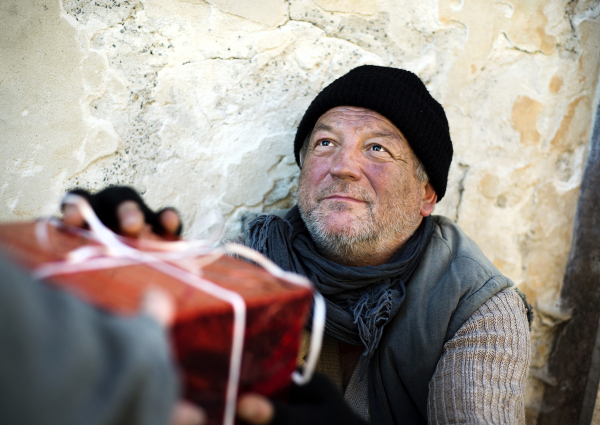 Christmas gift for homeless man in the street