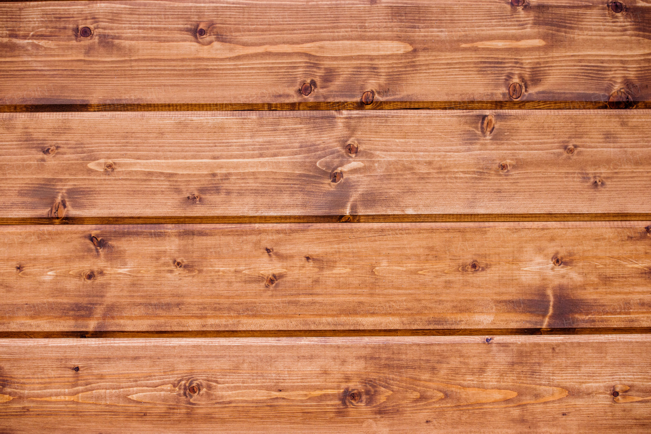 Board with texture laid on wooden floor background. Copy space.