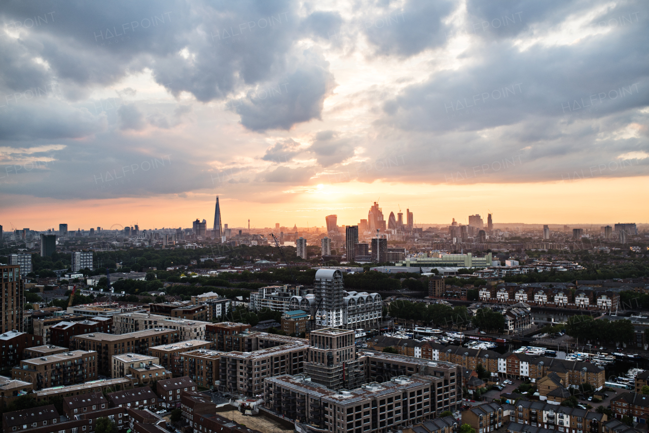 A sunset over a London skyline panorama.