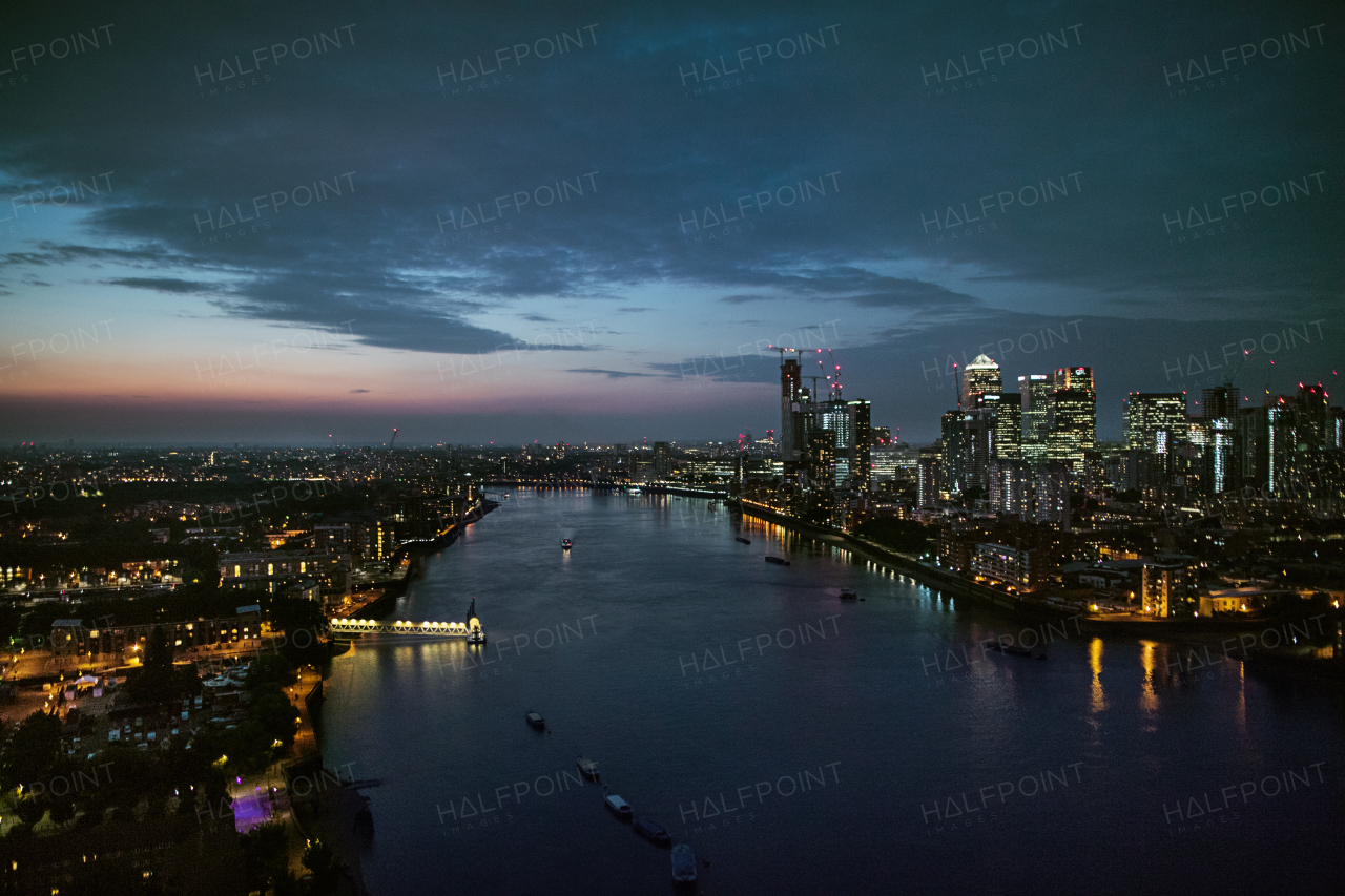 A dusk over a London skyline panorama with the river Thames.