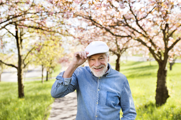 Handsome senior man outside in spring nature.