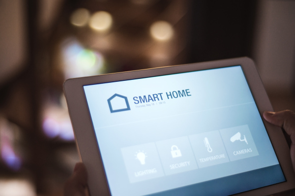 A tablet with smart home control system.