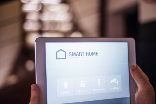 A tablet with smart home control system.