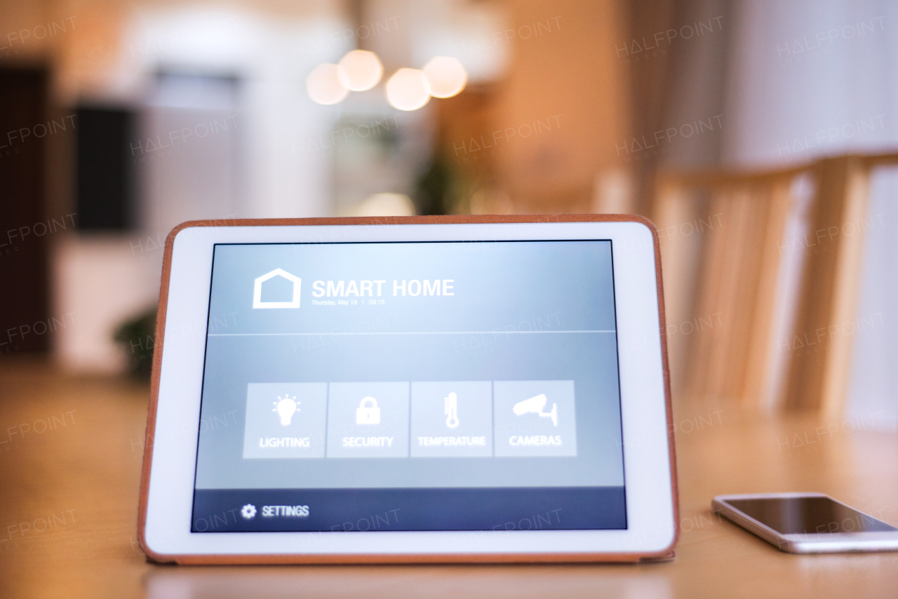 A tablet with smart home control system.