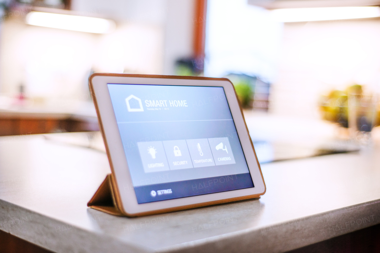 A tablet with smart home control system.