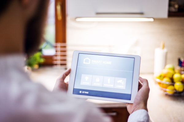 A tablet with smart home control system.