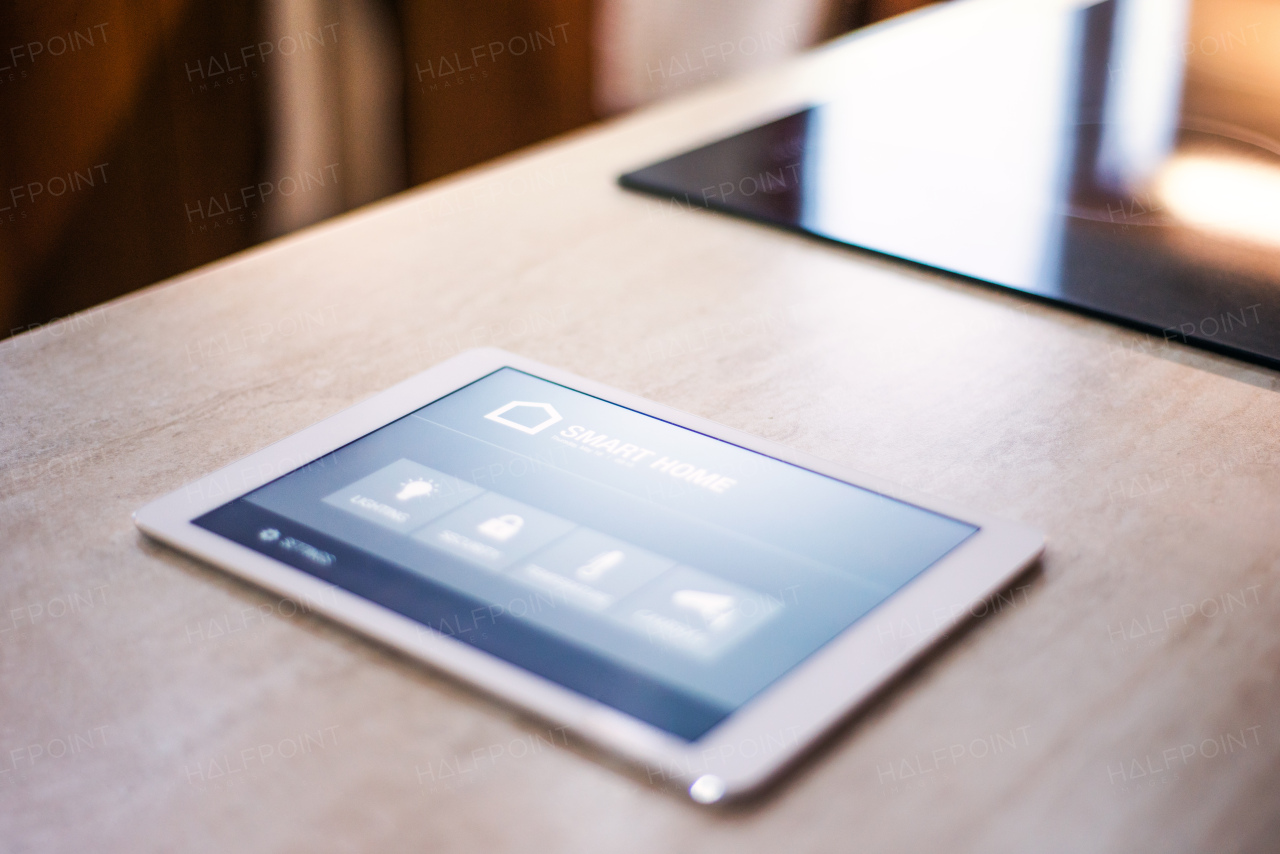 A tablet with smart home control system.