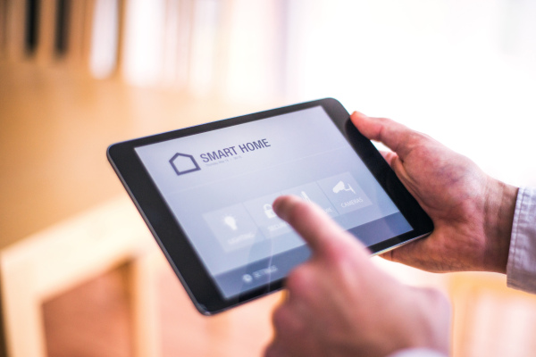 A tablet with smart home control system.