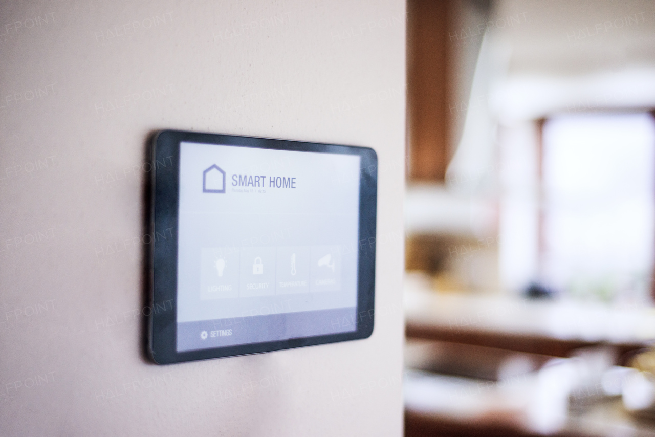 A tablet with smart home control system.