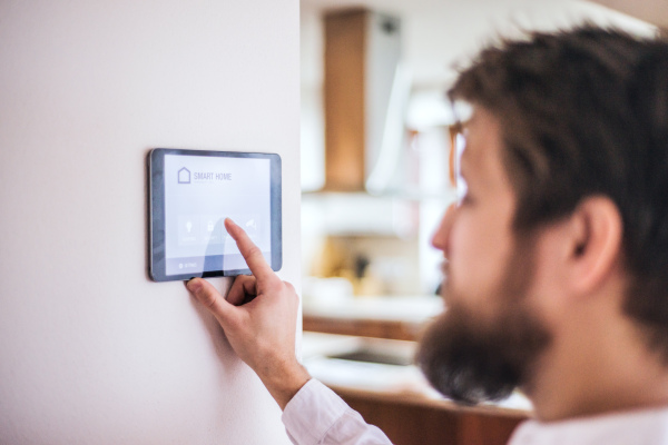 A tablet with smart home control system.